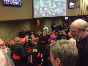 The Pope packing up his things at Synod's end after he'd given another stirring talk. Cardinal Pell can also be seen. A bit like Where's Wally?