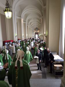 A shot of the bishops returning to the vesting area just off the atrium of St Peter's after the closing Mass. Through the Bronze Door we could see the large mob gathering for the midday Angelus.