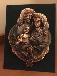 Here's one of the commemorative gifts we were given - a rather lovely image in metal of the Holy Family. 