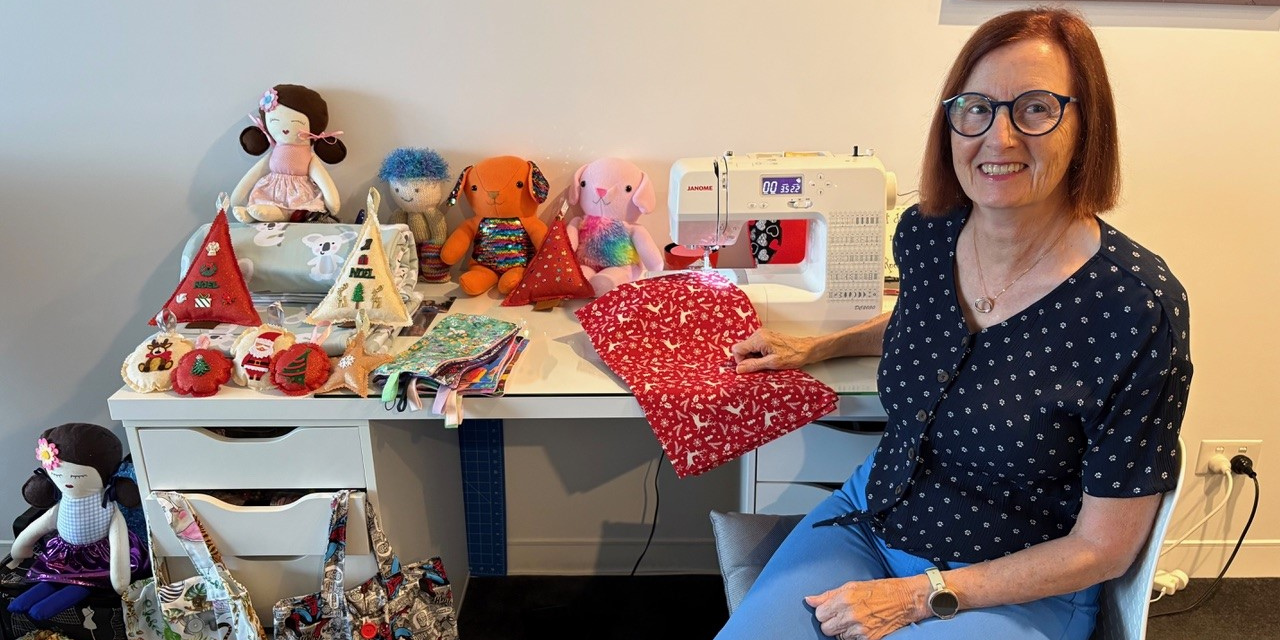 Gold Coast volunteer Lynda sews beautiful Santa sacks for the donated Christmas gifts.